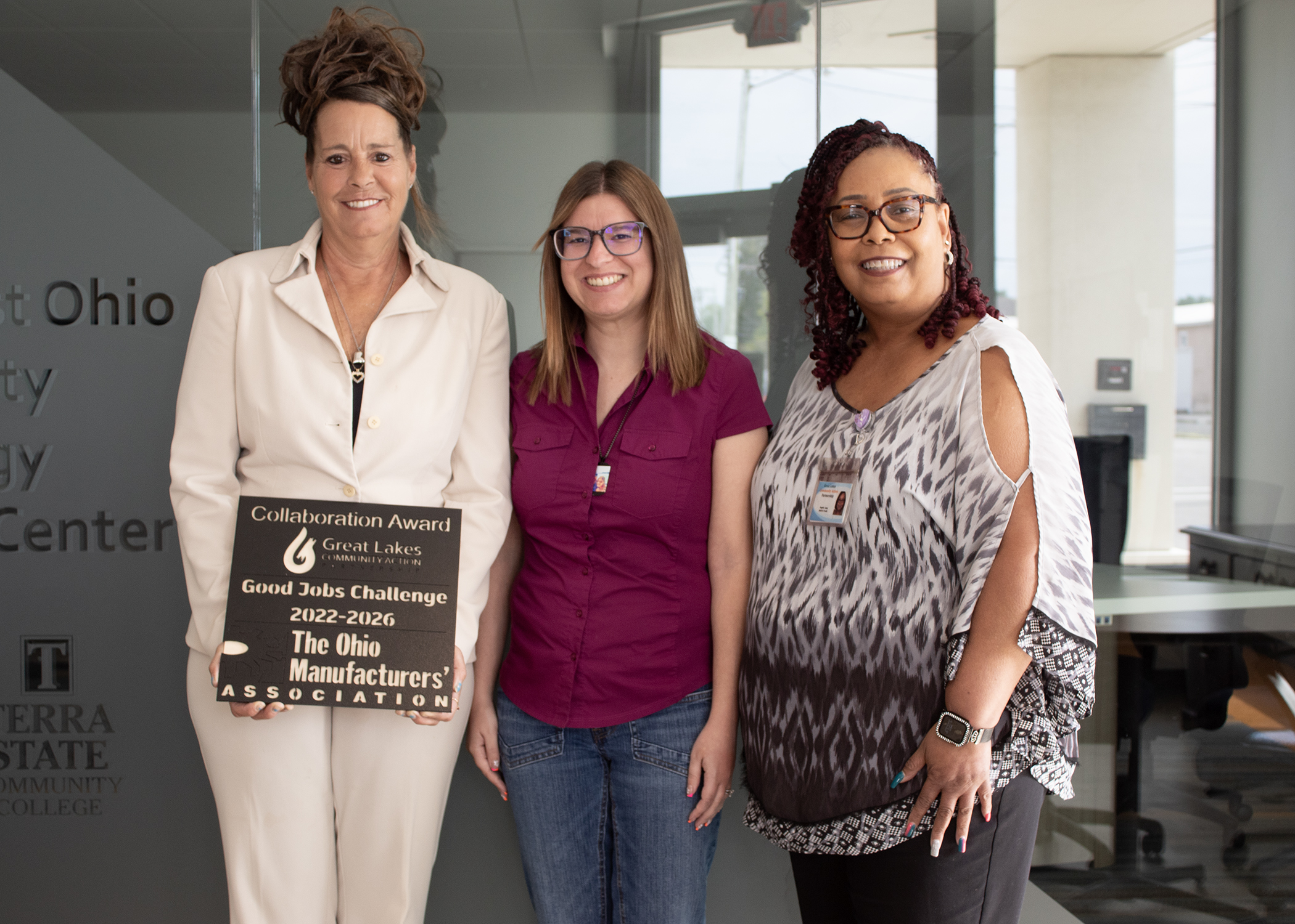 Three women with award from Ohio Manufacturers Association