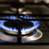 Gas burner lit on the top of a stove