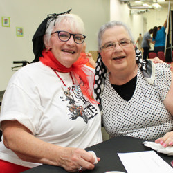 Seniors dressed in 1950s apparel at sock hop event
